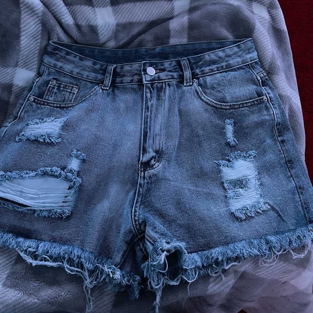 jean shorts from SHEIN, they are a large and obviously ripped style.